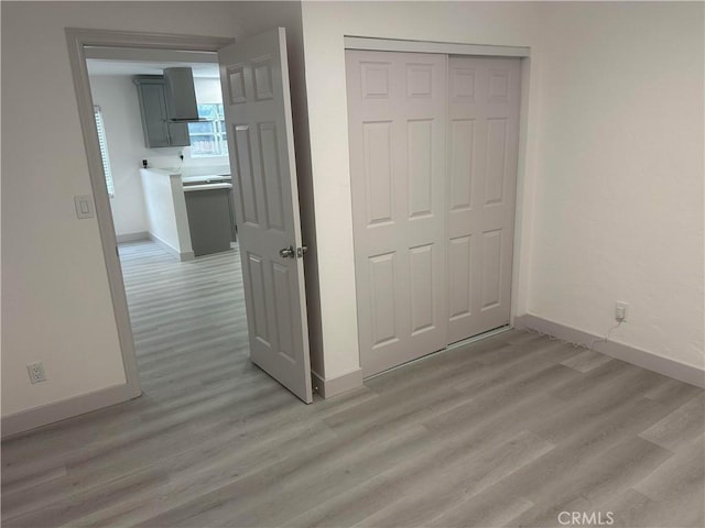 4300 Bancroft Dr, La Mesa, CA 91941 - unfurnished bedroom featuring light wood-style flooring, baseboards, and a closet