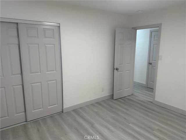 4300 Bancroft Dr, La Mesa, CA 91941 - unfurnished bedroom with light wood-style floors, baseboards, and a closet