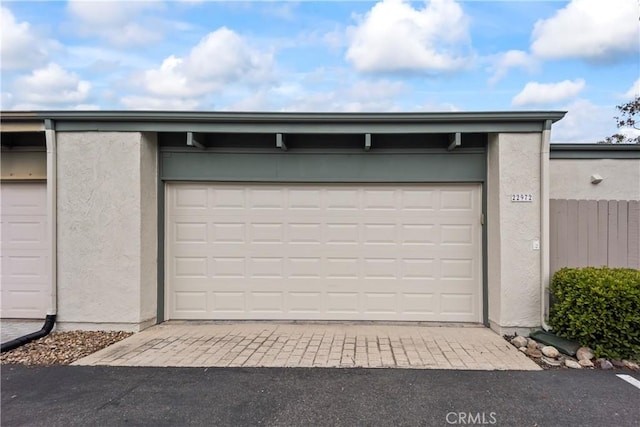 22972 Caminito Linda, Laguna Hills, CA 92653 - garage featuring asphalt driveway