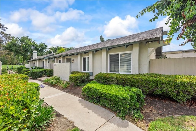 22972 Caminito Linda, Laguna Hills, CA 92653 - view of front of home with stucco siding and a chimney