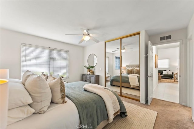 22972 Caminito Linda, Laguna Hills, CA 92653 - bedroom featuring light carpet, a ceiling fan, and a closet