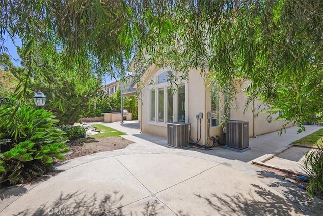 20333 Wynfreed Ln, Porter Ranch, CA 91326 - rear view of house featuring stucco siding and a patio