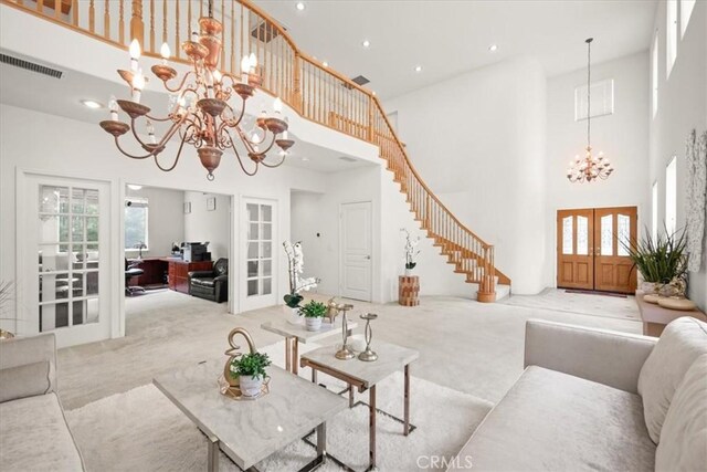 20333 Wynfreed Ln, Porter Ranch, CA 91326 - living room with french doors, a chandelier, carpet floors, a towering ceiling, and stairway