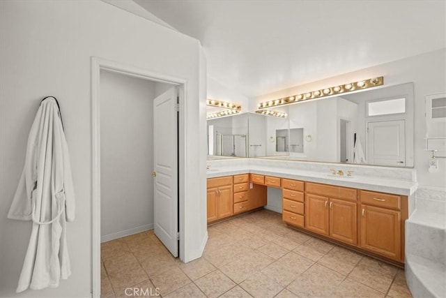 20333 Wynfreed Ln, Porter Ranch, CA 91326 - bathroom with double vanity, a tub to relax in, and tile patterned floors