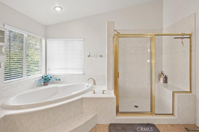 20333 Wynfreed Ln, Porter Ranch, CA 91326 - full bath with healthy amount of natural light, a bath, a stall shower, and lofted ceiling