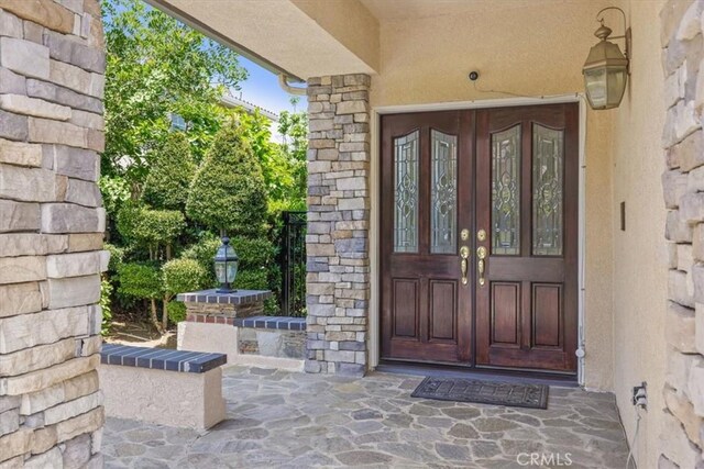 20333 Wynfreed Ln, Porter Ranch, CA 91326 - property entrance with french doors and stucco siding