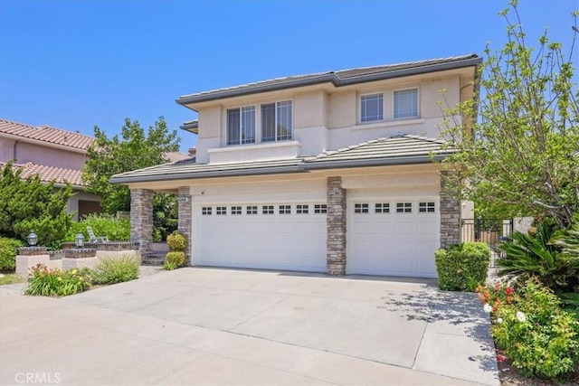 20333 Wynfreed Ln, Porter Ranch, CA 91326 - view of front of property with an attached garage, stucco siding, driveway, stone siding, and a tiled roof