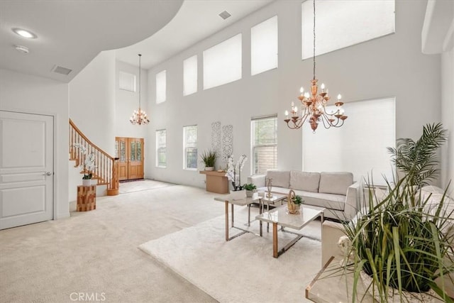 20333 Wynfreed Ln, Porter Ranch, CA 91326 - living room with a chandelier, carpet, a towering ceiling, and stairs