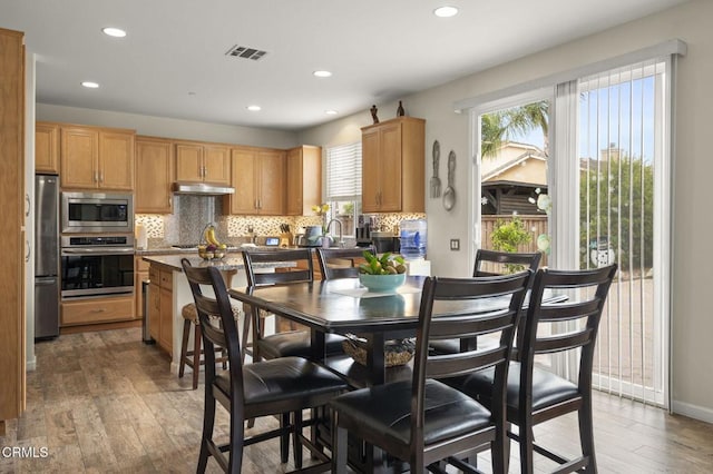 371 Huerta St, Oxnard, CA 93030 - dining space with wood-type flooring and recessed lighting