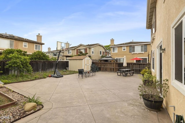 371 Huerta St, Oxnard, CA 93030 - fenced backyard featuring a residential view, a storage unit, and a patio area