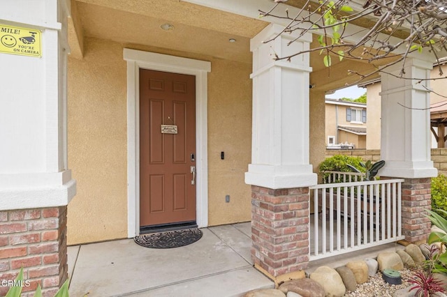371 Huerta St, Oxnard, CA 93030 - view of exterior entry featuring covered porch and stucco siding