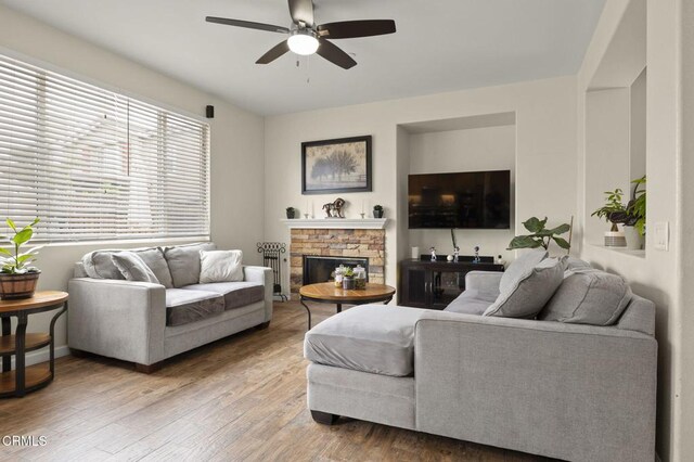 371 Huerta St, Oxnard, CA 93030 - living room with a ceiling fan, a glass covered fireplace, and wood finished floors