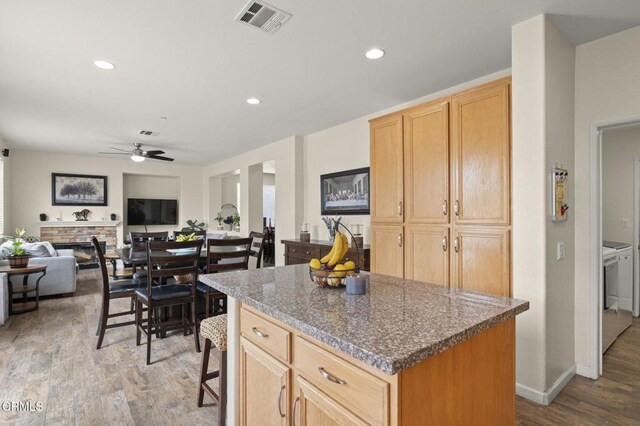 371 Huerta St, Oxnard, CA 93030 - kitchen featuring a ceiling fan, wood finished floors, a center island, light brown cabinetry, and recessed lighting