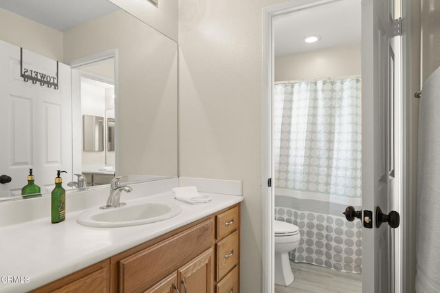 371 Huerta St, Oxnard, CA 93030 - bathroom featuring vanity, wood finished floors, and a shower with curtain