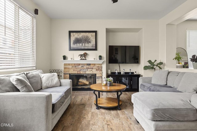 371 Huerta St, Oxnard, CA 93030 - living area featuring wood finished floors and a stone fireplace