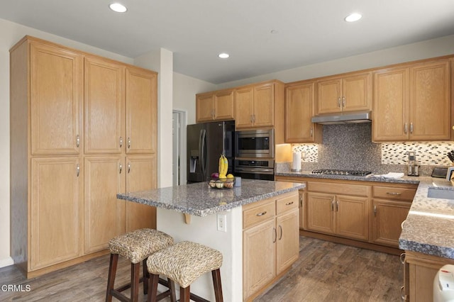371 Huerta St, Oxnard, CA 93030 - kitchen featuring refrigerator with ice dispenser, wall oven, stainless steel microwave, under cabinet range hood, and gas cooktop