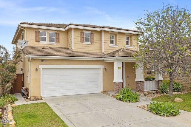 371 Huerta St, Oxnard, CA 93030 - view of front of property featuring driveway, a garage, a porch, stucco siding, and a tile roof