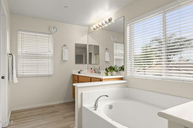 371 Huerta St, Oxnard, CA 93030 - full bath with a bath, vanity, and wood finished floors