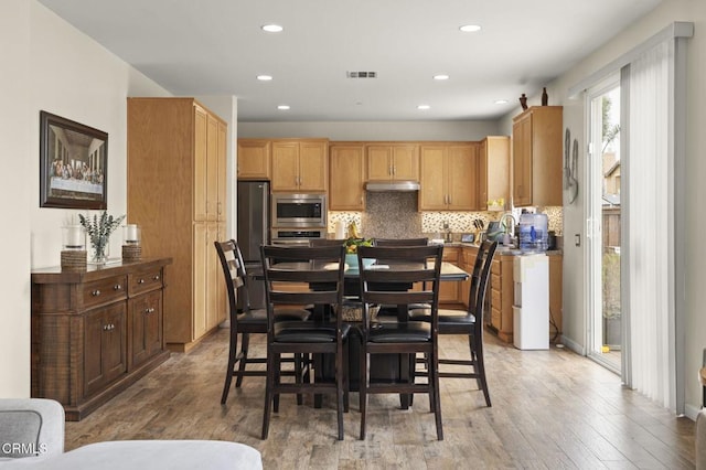 371 Huerta St, Oxnard, CA 93030 - dining room with light wood-type flooring and recessed lighting
