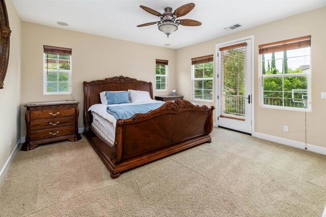 6851 Helenite Pl, Carlsbad, CA 92009 - bedroom with access to exterior, baseboards, multiple windows, and light colored carpet