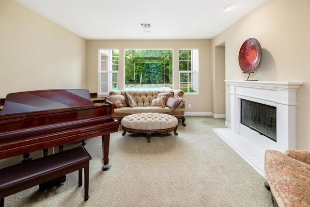 6851 Helenite Pl, Carlsbad, CA 92009 - sitting room featuring carpet floors, a glass covered fireplace, and baseboards
