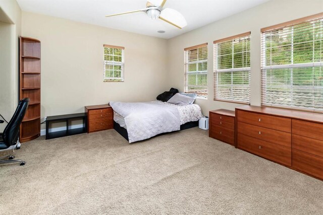 6851 Helenite Pl, Carlsbad, CA 92009 - bedroom with light colored carpet, a desk, and ceiling fan