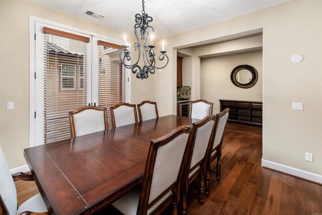 6851 Helenite Pl, Carlsbad, CA 92009 - dining area with a chandelier, baseboards, and dark wood-style flooring