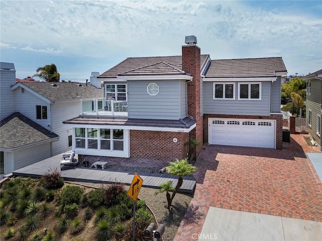 34155 Calle Ln, Primavera, Dana Point, CA 92629 - view of front of home featuring brick siding, decorative driveway, a balcony, and an attached garage
