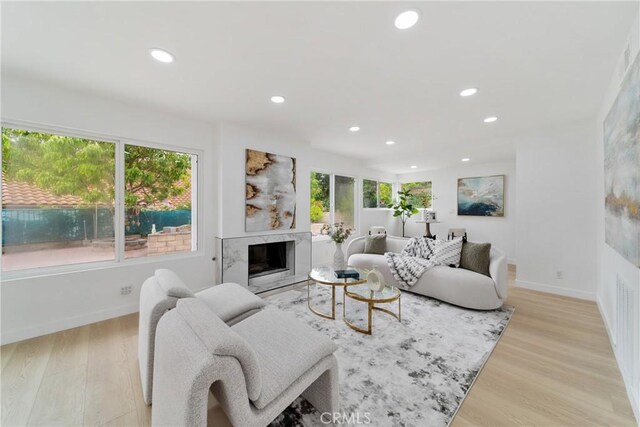 16247 Elza Dr, Hacienda Heights, CA 91745 - living room with recessed lighting, light wood finished floors, baseboards, and a high end fireplace