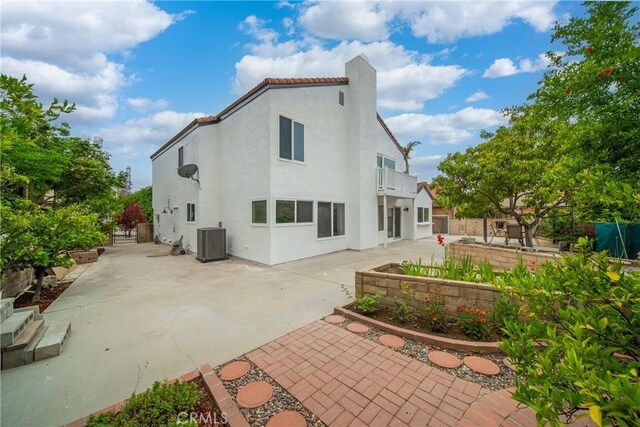 16247 Elza Dr, Hacienda Heights, CA 91745 - rear view of property with central AC unit, a patio, stucco siding, a chimney, and a balcony