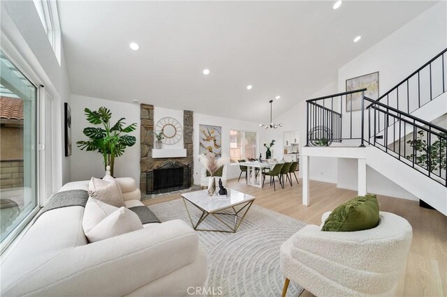 16247 Elza Dr, Hacienda Heights, CA 91745 - living room with high vaulted ceiling, stairs, light wood-style flooring, a chandelier, and recessed lighting
