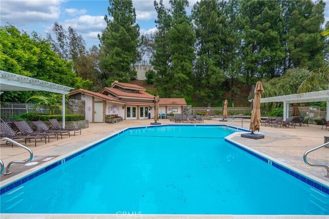 16247 Elza Dr, Hacienda Heights, CA 91745 - community pool with french doors, a patio area, and view of wooded area