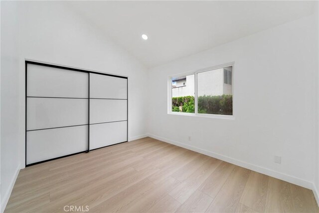 16247 Elza Dr, Hacienda Heights, CA 91745 - unfurnished bedroom featuring light wood-style flooring, vaulted ceiling, baseboards, and recessed lighting