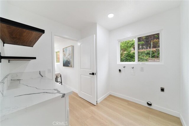 16247 Elza Dr, Hacienda Heights, CA 91745 - washroom featuring electric dryer hookup, light wood-type flooring, baseboards, and washer hookup