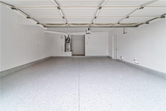 16247 Elza Dr, Hacienda Heights, CA 91745 - garage featuring baseboards, a garage door opener, and water heater