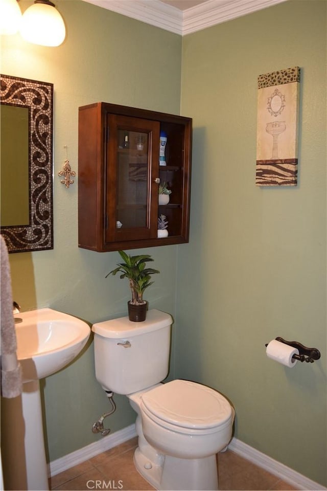 920 Nettle Ct, Corona, CA 92878 - bathroom featuring toilet, ornamental molding, tile patterned flooring, and baseboards
