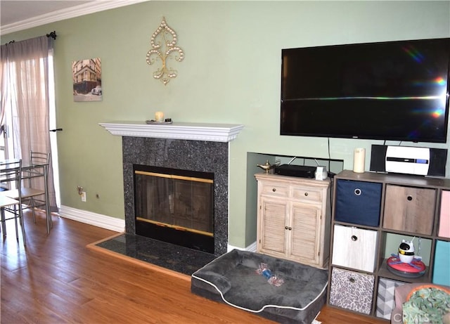 920 Nettle Ct, Corona, CA 92878 - living area featuring wood finished floors, baseboards, ornamental molding, and a fireplace