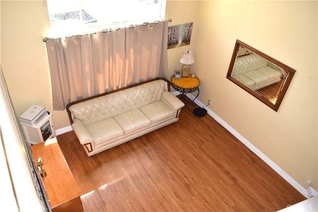 920 Nettle Ct, Corona, CA 92878 - living area featuring wood finished floors and baseboards