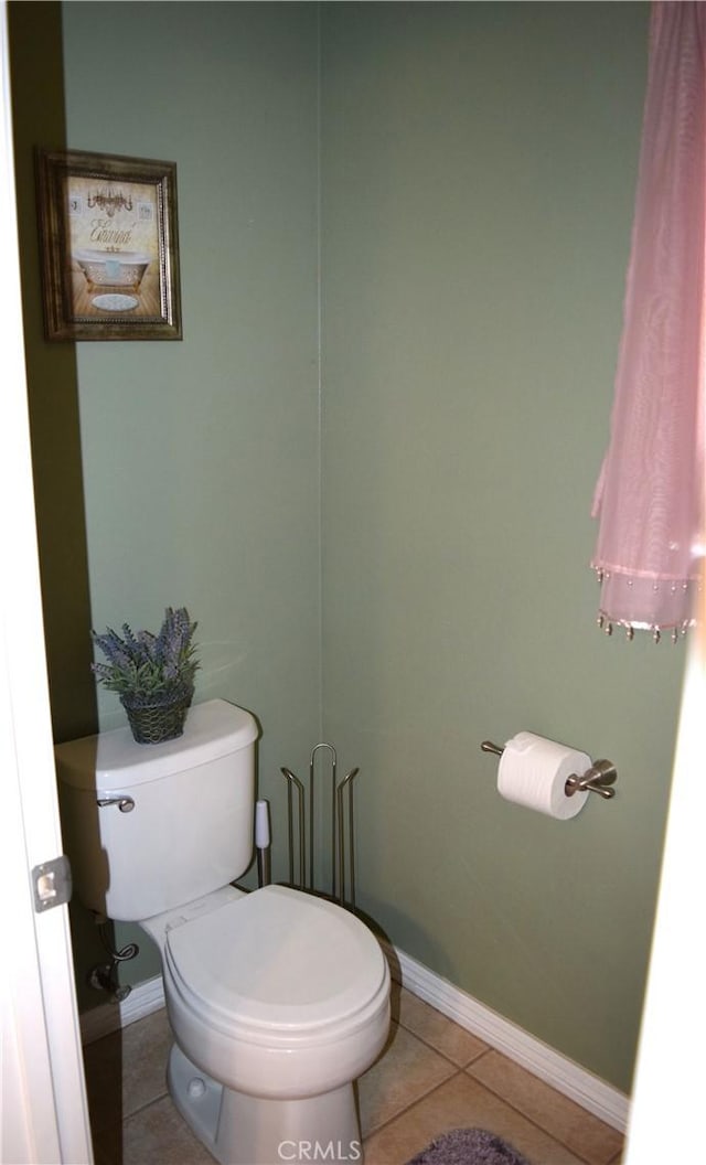 920 Nettle Ct, Corona, CA 92878 - bathroom with toilet, tile patterned floors, and baseboards