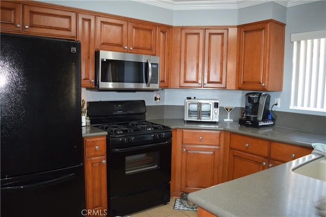 920 Nettle Ct, Corona, CA 92878 - kitchen with black appliances, ornamental molding, brown cabinets, and light tile patterned flooring
