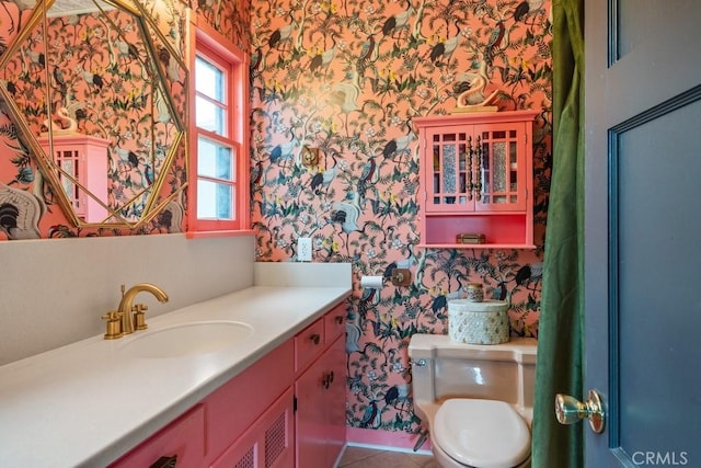 1131 S Vicentia Ave, Corona, CA 92882 - bathroom with wallpapered walls, toilet, vanity, tile patterned flooring, and baseboards