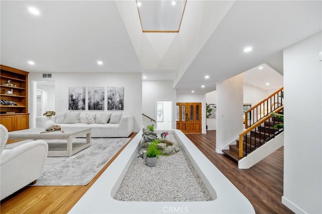 2545 Scenic Ridge Dr, Chino Hills, CA 91709 - living room with wood finished floors, stairs, and recessed lighting
