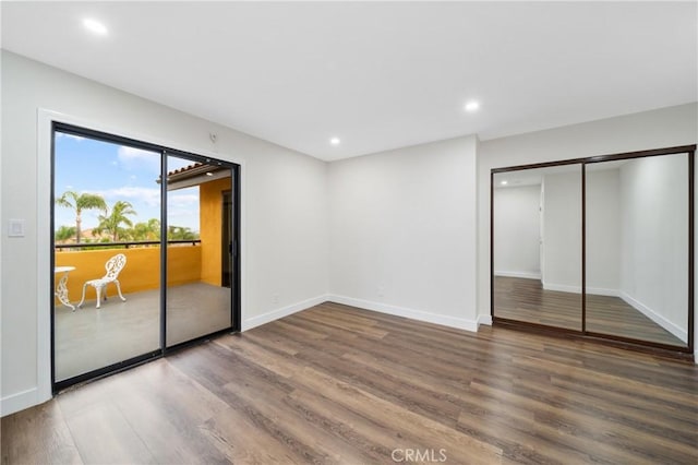 2545 Scenic Ridge Dr, Chino Hills, CA 91709 - unfurnished bedroom featuring wood finished floors, recessed lighting, baseboards, access to outside, and a closet