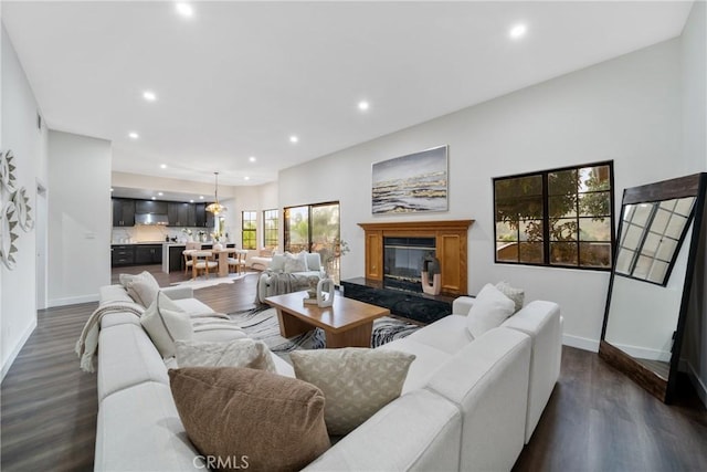 2545 Scenic Ridge Dr, Chino Hills, CA 91709 - living room featuring recessed lighting, dark wood finished floors, baseboards, and a premium fireplace