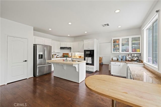 27625 Mariposa Ln, Castaic, CA 91384 - kitchen featuring black appliances, white cabinets, glass insert cabinets, dark wood-style flooring, and recessed lighting