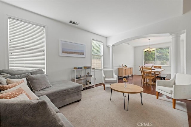 27625 Mariposa Ln, Castaic, CA 91384 - living area featuring ornate columns, a chandelier, and arched walkways