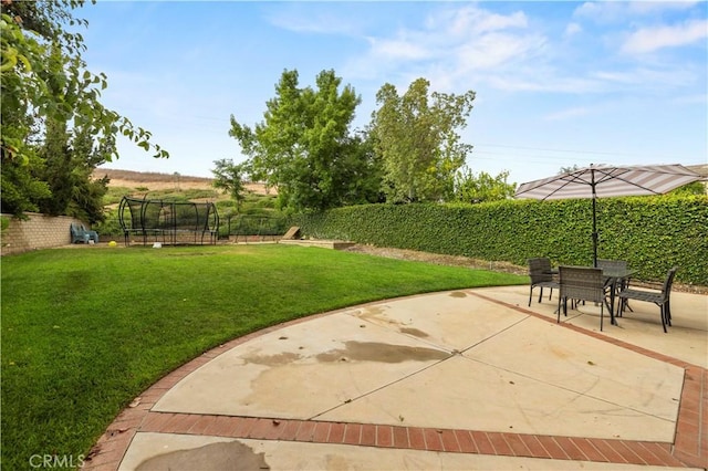 27625 Mariposa Ln, Castaic, CA 91384 - view of yard featuring a trampoline, a patio, and outdoor dining area