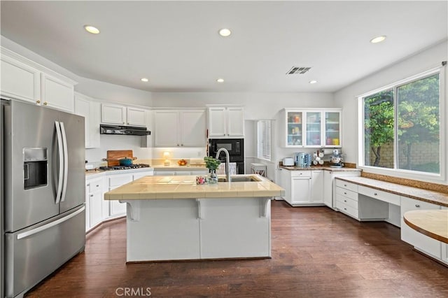 27625 Mariposa Ln, Castaic, CA 91384 - kitchen featuring stainless steel appliances, under cabinet range hood, white cabinets, tile counters, and recessed lighting