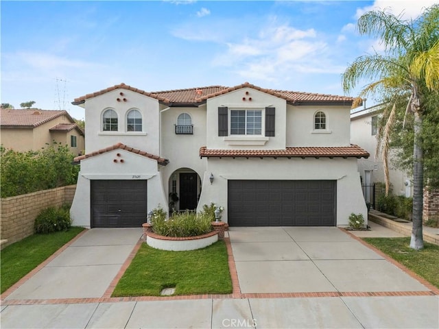 27625 Mariposa Ln, Castaic, CA 91384 - mediterranean / spanish-style house featuring a garage, a tile roof, driveway, and stucco siding