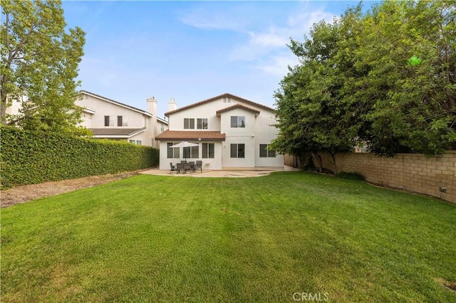 27625 Mariposa Ln, Castaic, CA 91384 - rear view of property featuring stucco siding and a patio area